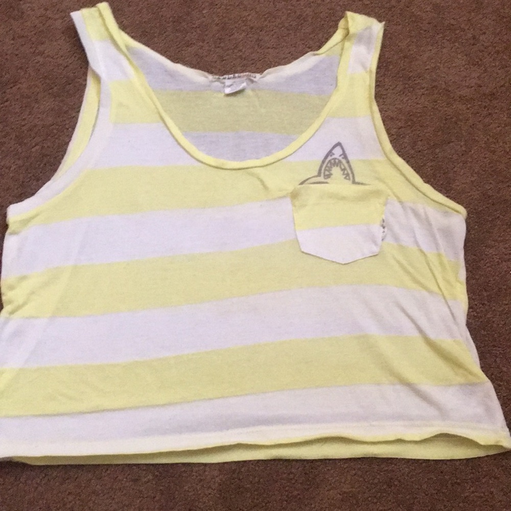 A white and yellow striped tank top with shark.